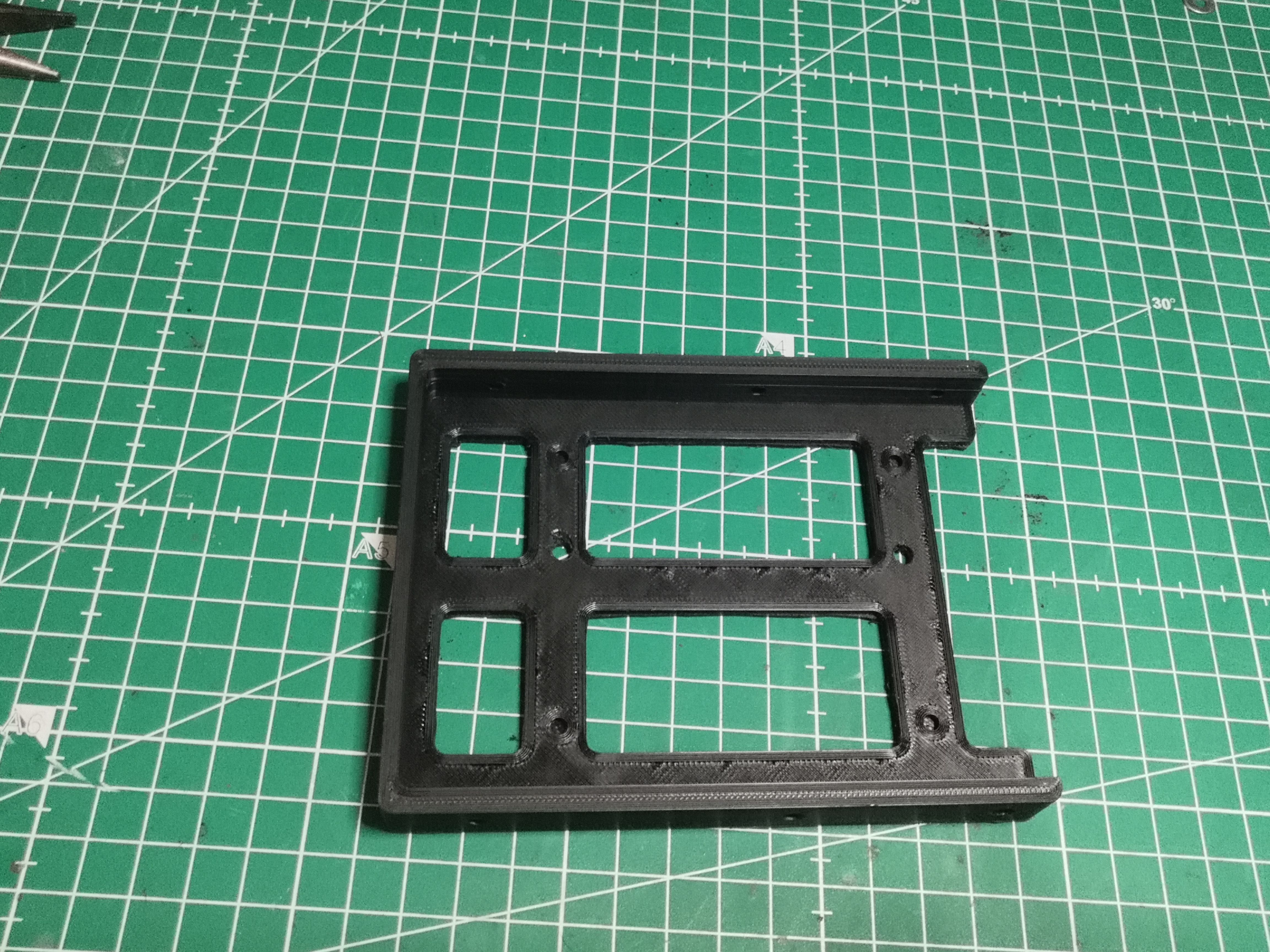 Caddy imprimé en PLA noir — vue du dessus